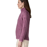 Side of woman wearing Patagonia's women's better sweater jacket in purple. The jacket has a regular fit 