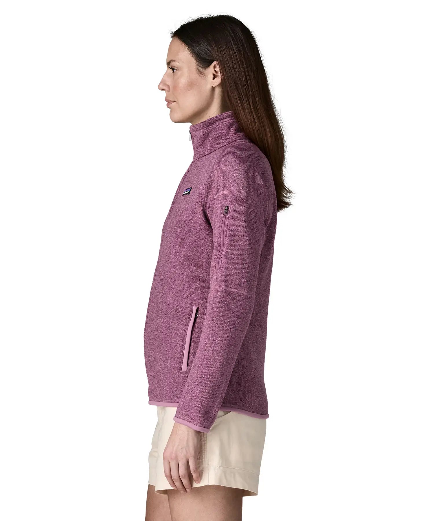 Side of woman wearing Patagonia's women's better sweater jacket in purple. The jacket has a regular fit 