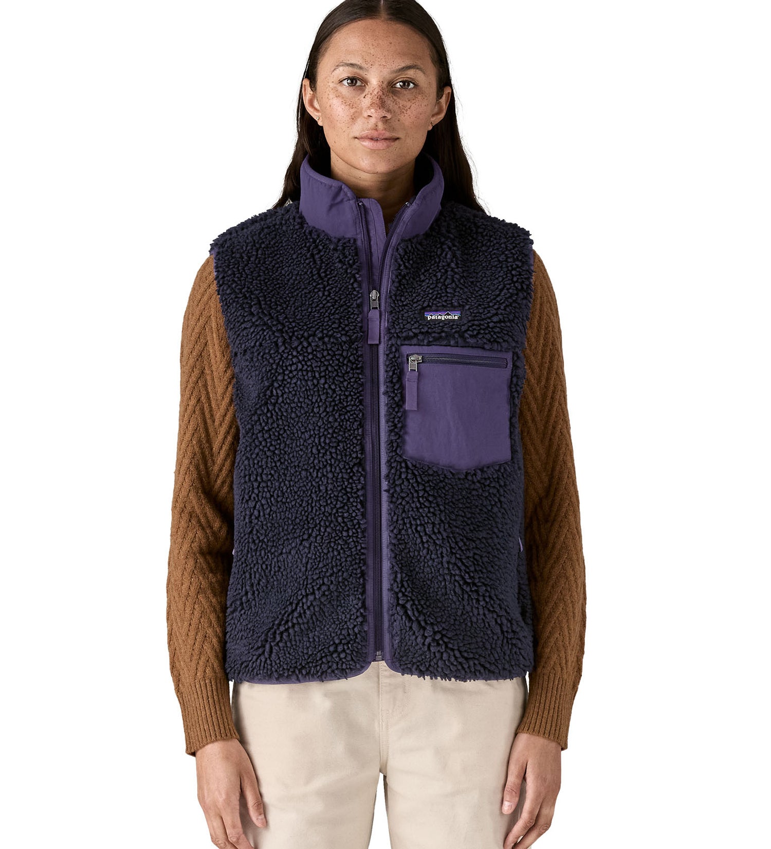 A model wearing the Patagonia womens classic retro x fleece vest available at Babipur showing the front fit of the gilet