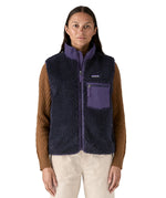 A model wearing the Patagonia womens classic retro x fleece vest available at Babipur showing the front fit of the gilet