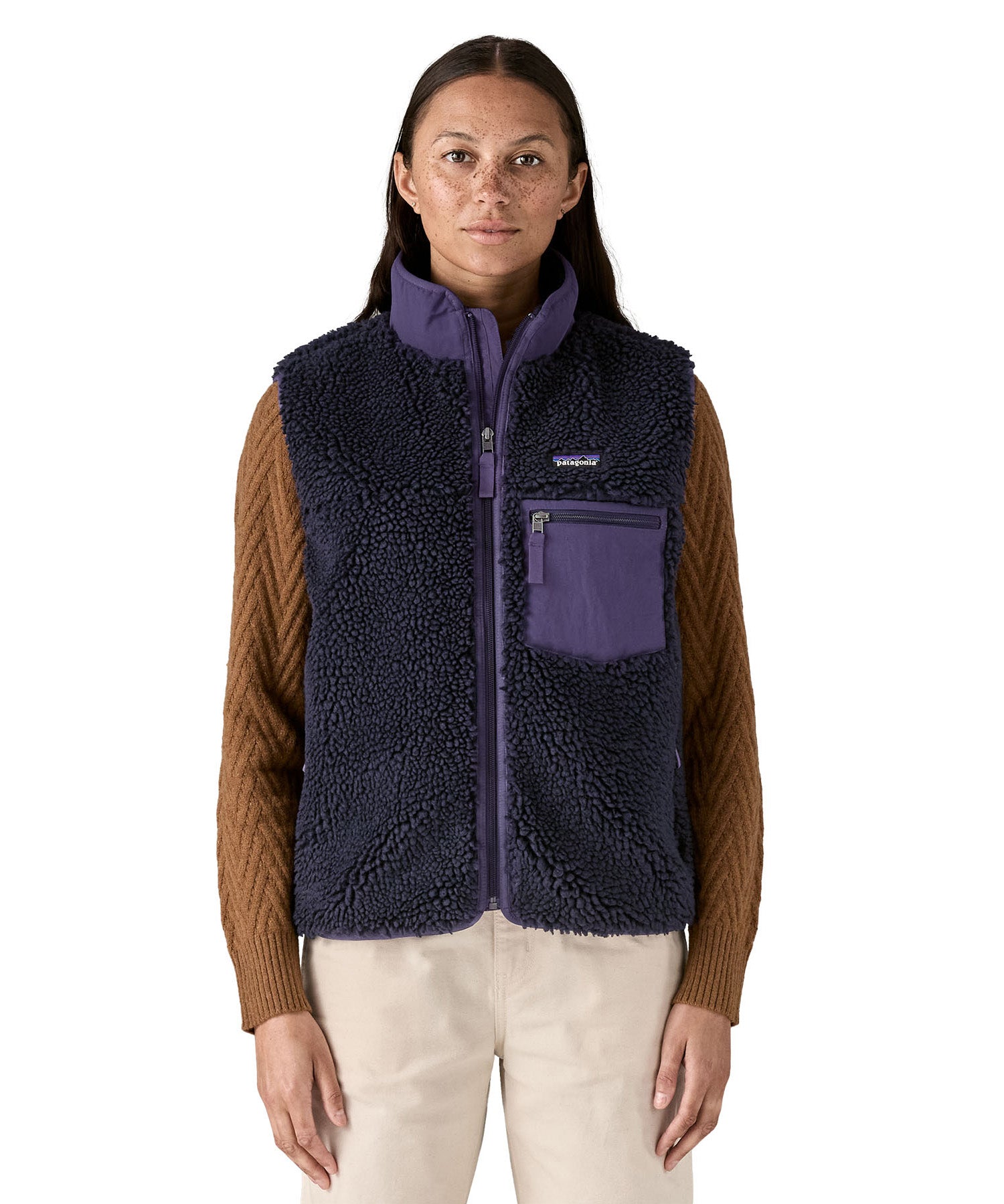 A model wearing the Patagonia womens classic retro x fleece vest available at Babipur showing the front fit of the gilet