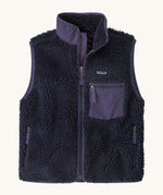Patagonia womens classic retro x fleece vest available at Babipur. A dark blue coloured thick fleece gilet with a dark purple trim. Features a full length zip, chest pocket and side pockets