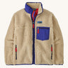 A Patagonia women's classic retro-x jacket in a dark natural colour way available at Babipur. A thick fleece with royal blue trim detail with a full length zip, 2 side pockets and a chest pocket with the logo patch stitched above.