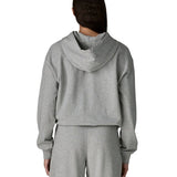 Back of woman wearing Patagonia's daily hoody in grey. Hoody has a relaxed fit and sits around the hips