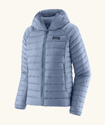 Patagonia women's down insulated sweater hoody in barnacle blue. Features a full length zip and side pockets