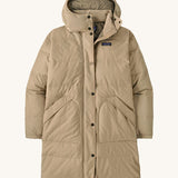 Patagonia womens downdrift parka jacket ir oar tan available at Babipur. A long length padded jacket in cream. Features a hood, full length zip with popper fastener and 2 side pockets