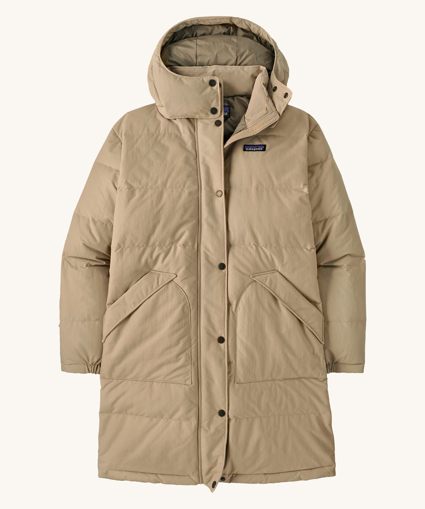 Patagonia womens downdrift parka jacket ir oar tan available at Babipur. A long length padded jacket in cream. Features a hood, full length zip with popper fastener and 2 side pockets
