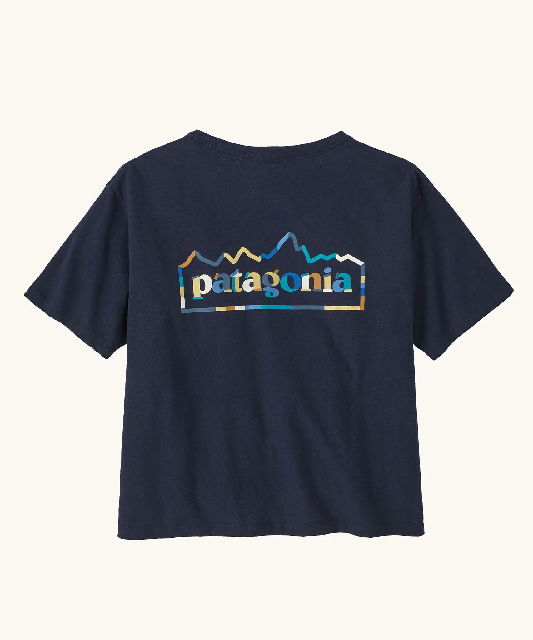 Patagonia women's unity Fitz roy responsibili tshirt. A navy blue, short sleeved and boxy top with the brand logo printed on the back. 