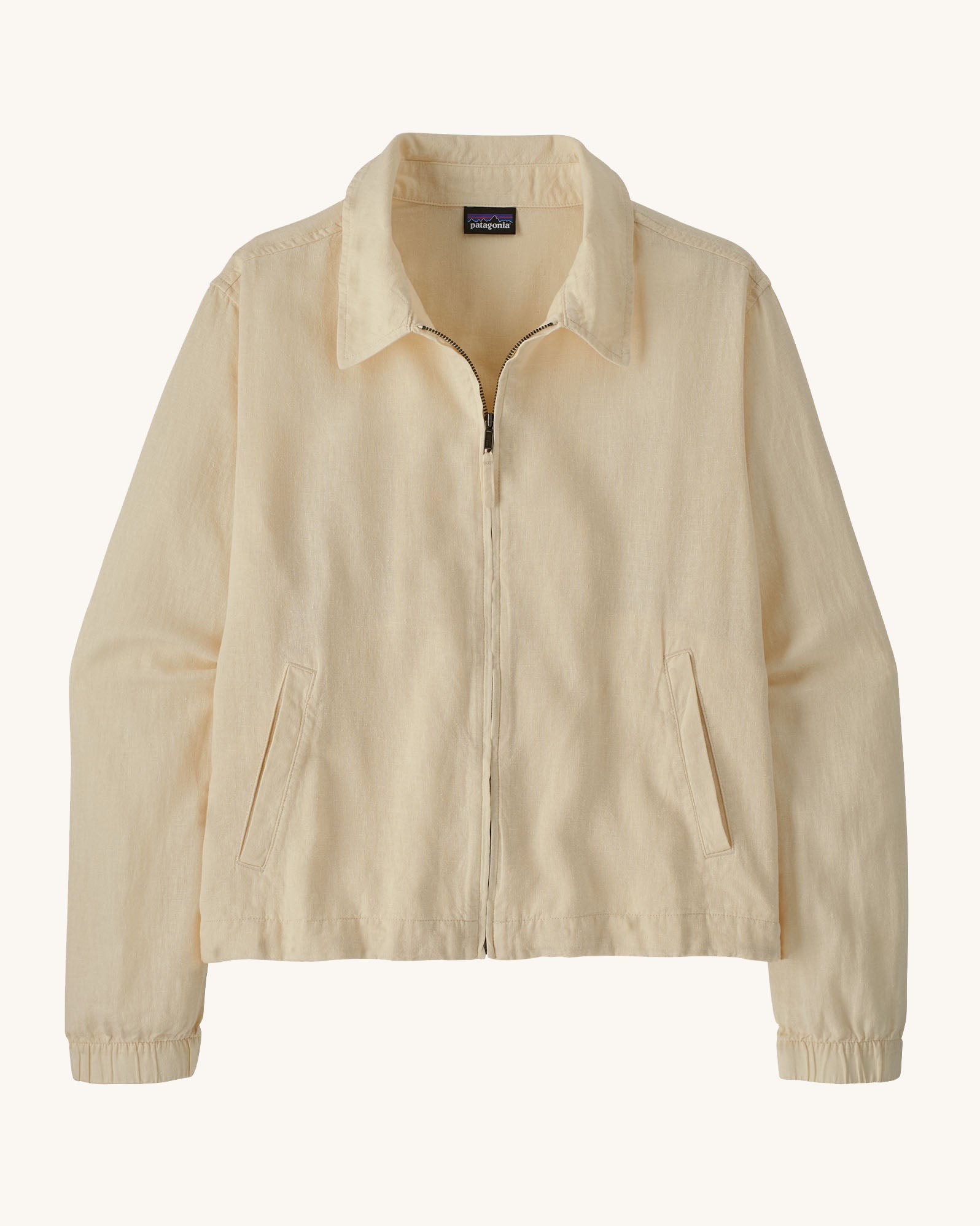 Patagonia women's lightweight jacket with collar in natural cream colour. Features a full length front zip and side pockets