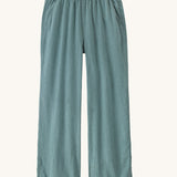 Patagonia women's garden island light weight pants in sage green. Shows 2 front pockets and a elasticated waist band