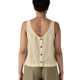 Woman wearing Patagonia women's reversible garden island vest top in cream showing full length back button fasteners