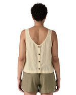 Woman wearing Patagonia women's reversible garden island vest top in cream showing full length back button fasteners