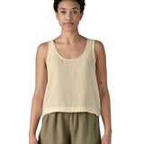 Woman wearing Patagonia women's reversible garden island vest top in cream. Vest top has a relaxed fit