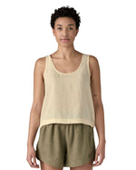 Woman wearing Patagonia women's reversible garden island vest top in cream. Vest top has a relaxed fit