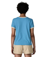 Back of woman wearing Patagonia women's great waves ringer t-shirt in light blue. Shows a white trim around the arms and collar