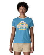 Woman wearing Patagonia women's great waves ringer t-shirt in light blue with a wave logo on the upper body.