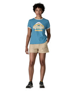 Woman wearing Patagonia women's great waves ringer t-shirt in light blue with a wave logo on the upper body. T-shirt has a regular fit