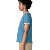 Side of Woman wearing Patagonia women great waves ringer t-shirt in light blue. Showing a white trim around the arm and collar. 