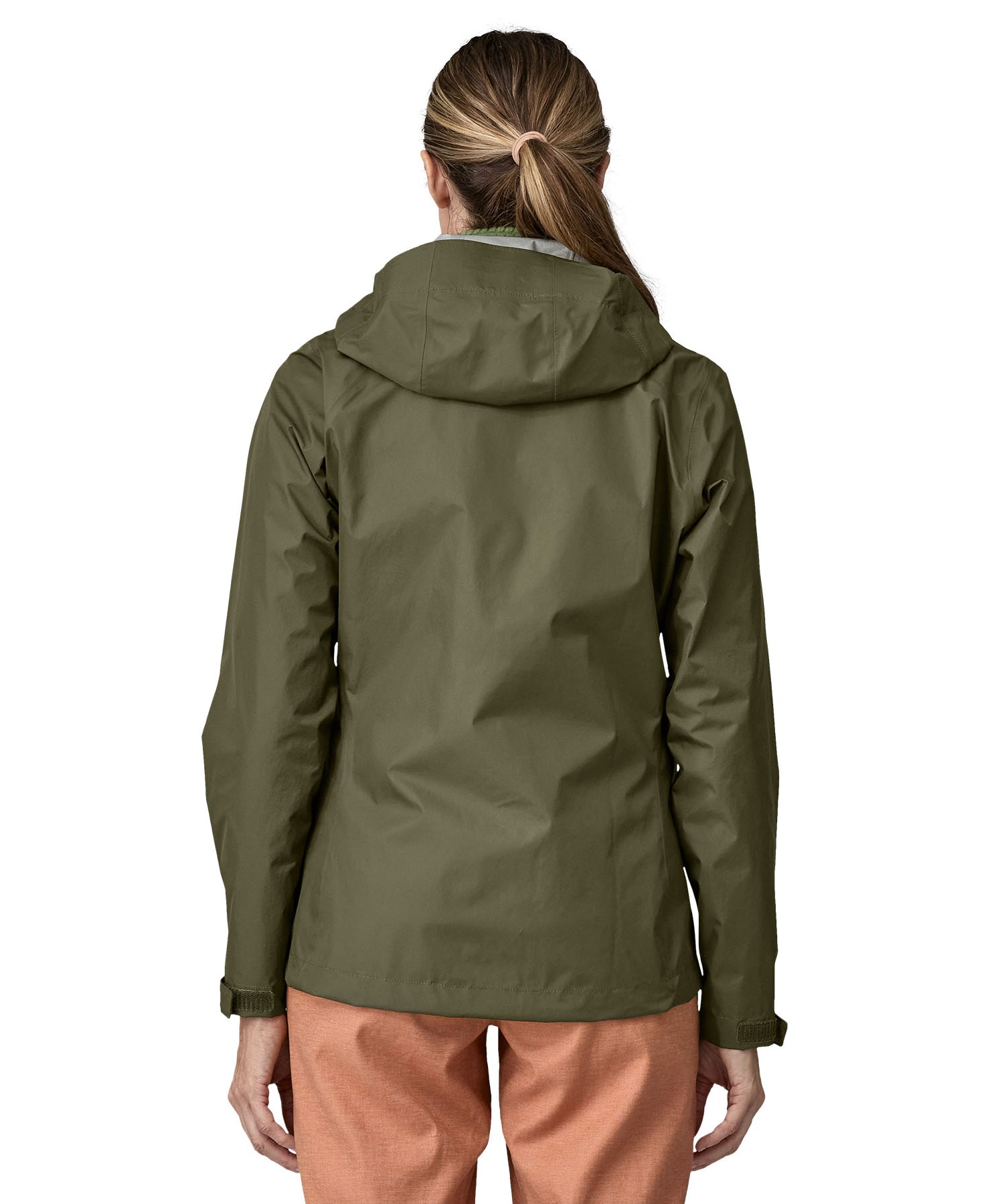 The back of the Patagonia Women's Torrentshell 3L Rain Jacket - Pine Needle Green. The image shows a person wearing the jacket to show the fit of the coat from the back and the hood