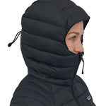 The hood up on the Patagonia Women's Down Sweater Hoody, showing how far it zips up to keep the chin and face warm
