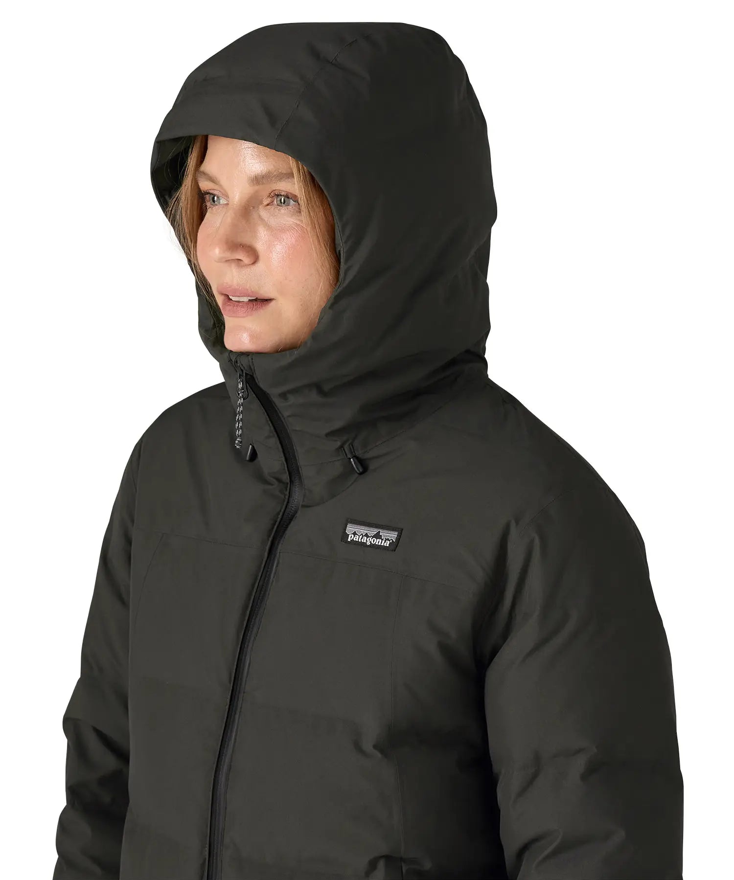 Hood on the Patagonia's waterproof women's Jackson glacier jacket in black  over the head