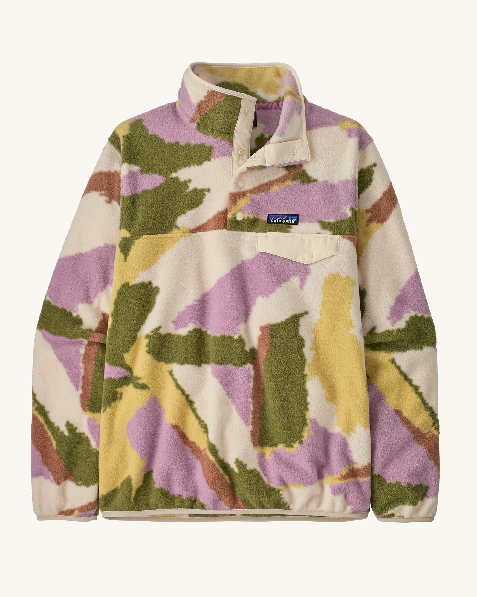Patagonia women's synchilla snap t fleece in cream with pastel abstract design. Shows 1/4 length front popper up to the collar and chest pocket
