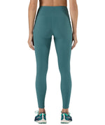 A model wearing the Patagonia women's leggings in wetland blue available at Babipur showing the back fit of the leggings