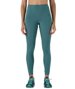 A model wearing the Patagonia women's leggings in wetland blue available at Babipur showing the front fit of the leggings