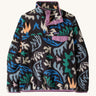 Patagonia women's synchilla snap t fleece in black with a retro abstract design. Shows a 1/4 length front popper up to the collar and a chest pocket