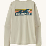 Patagonia women's long sleeve capilene cool t-shirt in cream with wave logo graphic on upper back