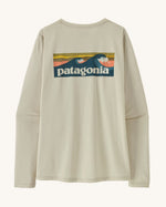 Patagonia women's long sleeve capilene cool t-shirt in cream with wave logo graphic on upper back