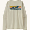 Patagonia women's long sleeve capilene cool t-shirt in cream with wave logo graphic on upper back