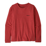 Patagonia women's responsibilli top in potters red available at Babipur. A long sleeve top with the brand name text  printed on the chest 