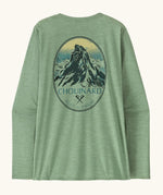 Patagonia women's long sleeve capilene top in light green with Chouniard crest design on upper back