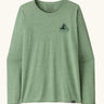 Patagonia women's long sleeve capilene techincal top in light green with mountain logo on the upper chest