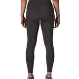 Back of woman wearing Patagonia's maipo stash black leggings. Tights have a high rise fit and 7/8 length