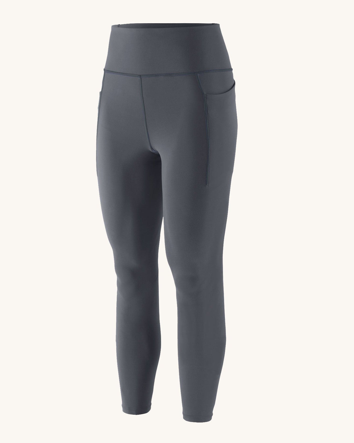 Patagonia women's activewear tights in dark blue with side pockets