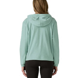 Back of woman wearing Patagonia's micro d hooded fleece in virtually blue. Fleece has a relaxed fit 