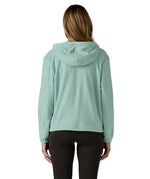 Back of woman wearing Patagonia's micro d hooded fleece in virtually blue. Fleece has a relaxed fit 