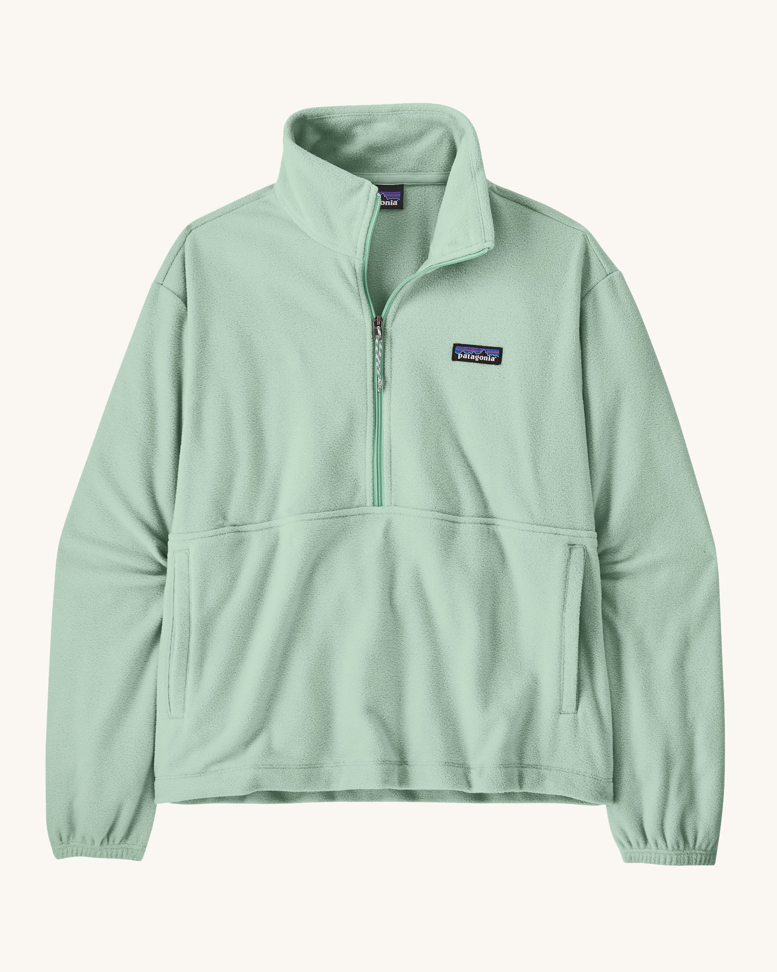 Patagonia women's micro d fleece in mint green with a half length front zip and side pockets
