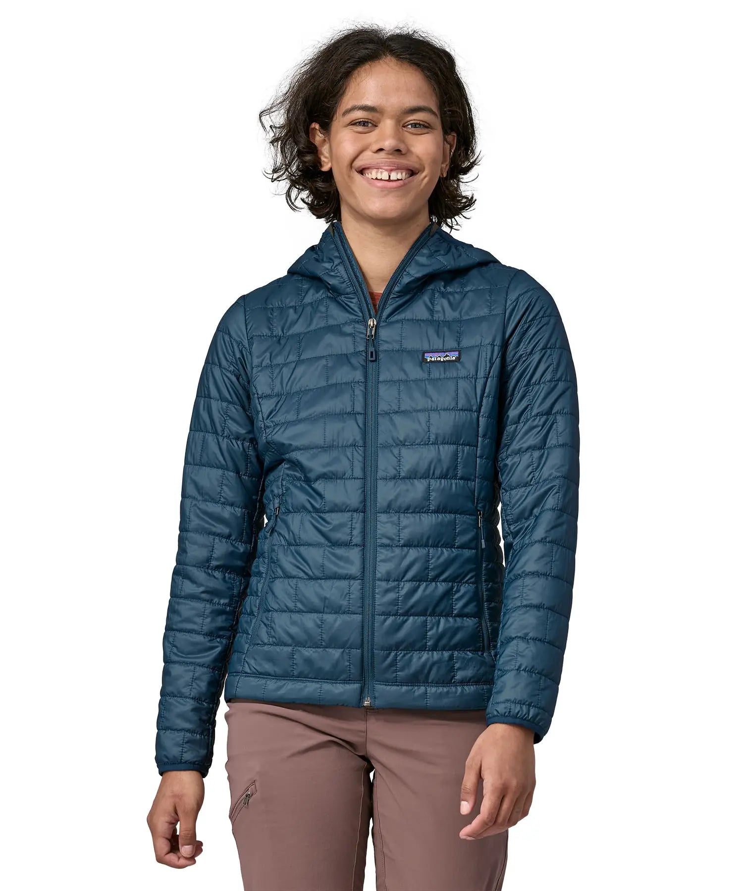 Woman wearing the Patagonia nano puff hoody jacket in a lagom blue. 