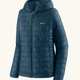 Patagonia women's nano puff hoody in a lagom blue. Features a full length zip and side pockets 
