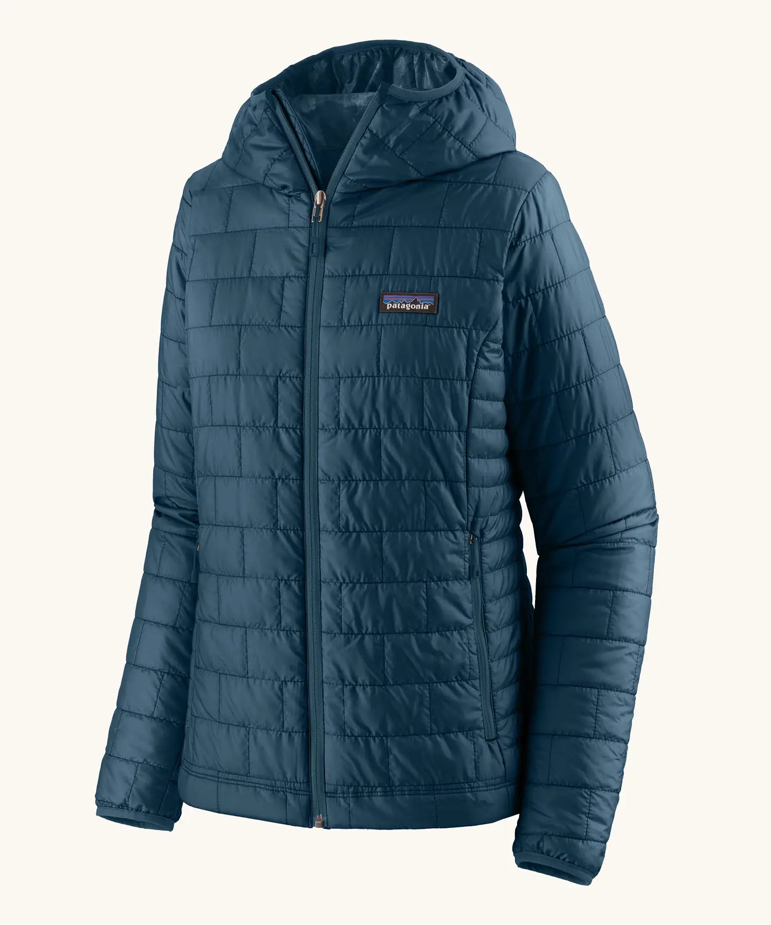 Patagonia women's nano puff hoody in a lagom blue. Features a full length zip and side pockets 