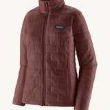 The front of the Patagonia women's nano puff jacket in dark ruby. A dark red jacket with rectangular puffer panels. Jacket features a full length zip and side pockets