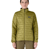 A female model wearing the Patagonia womens nano puff jacket in graze green showing the front fit of the jacket