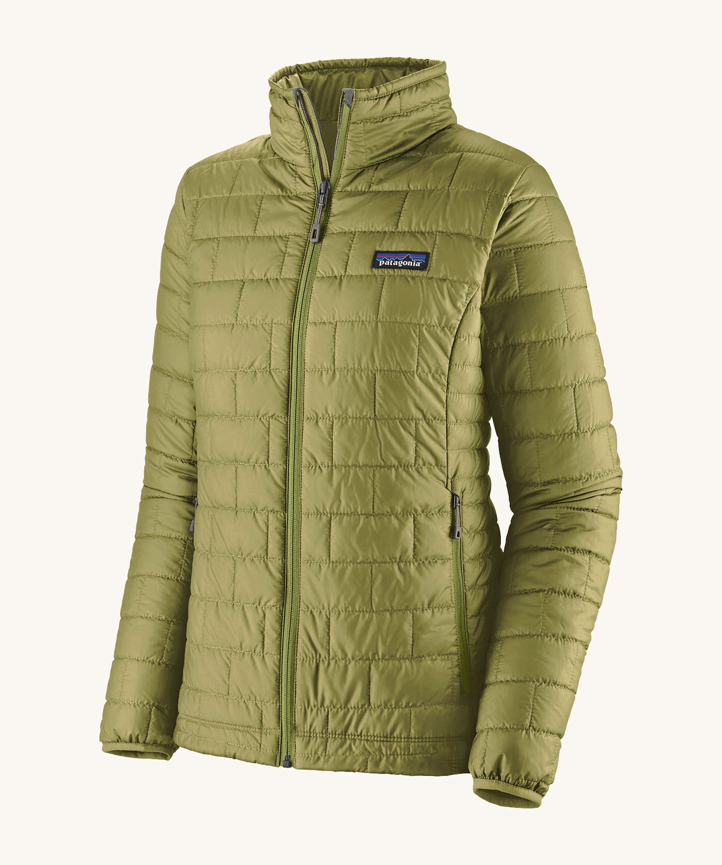 The front of the Patagonia womens nano puff jacket in graze green. A dark green jacket with rectangular puffer panels. Jacket features a full length zip and side pockets
