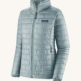 The front of the Patagonia women's nano puff jacket in thermal blue. A light blue jacket with rectangular puffer panels. Jacket features a full length zip and side pockets