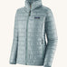 The front of the Patagonia women's nano puff jacket in thermal blue. A light blue jacket with rectangular puffer panels. Jacket features a full length zip and side pockets
