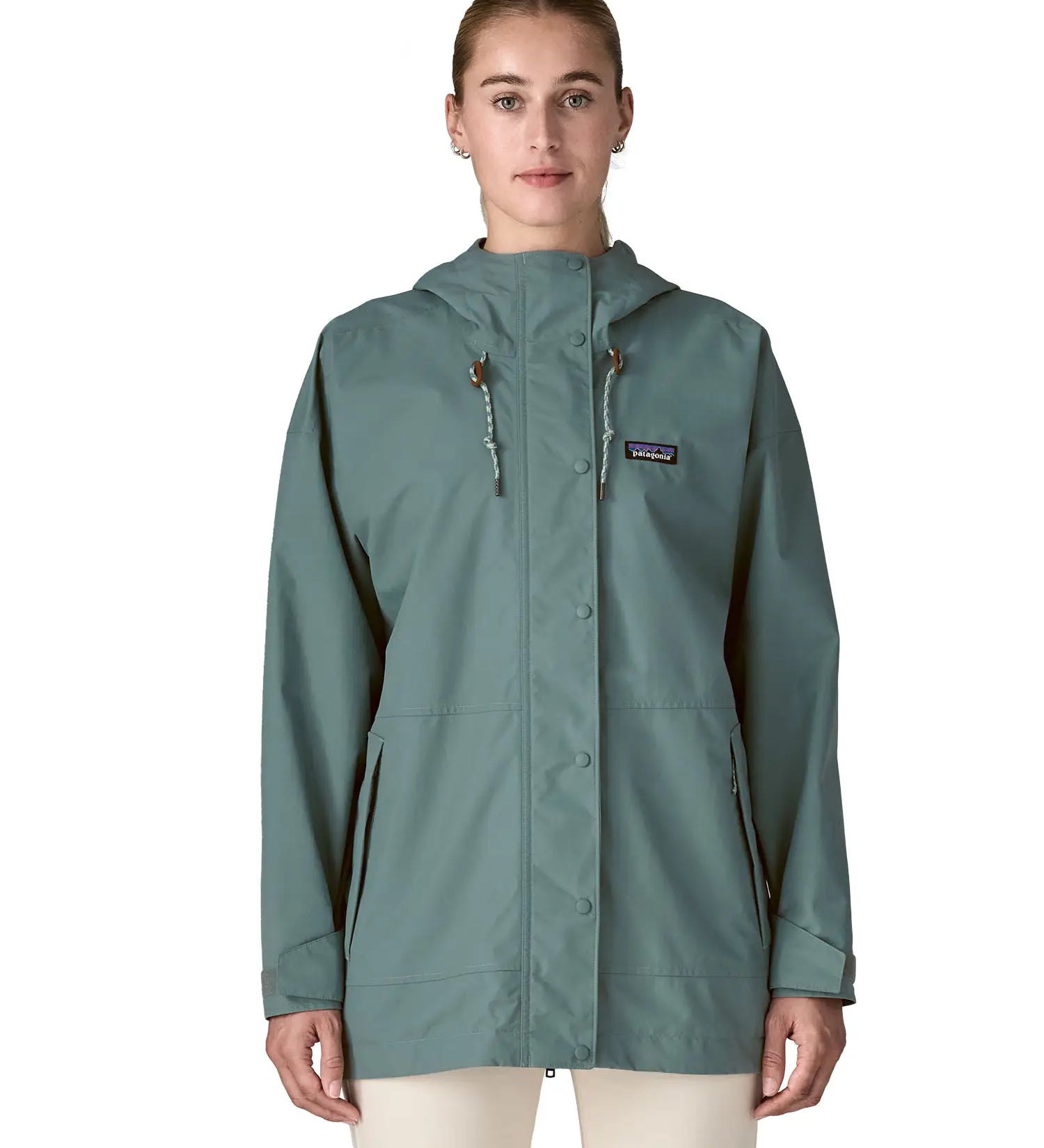 Woman wearing Patagonia outdoor everyday rain jacket in blue sage full zipped showing hood toggles. Coat has a relaxed fit