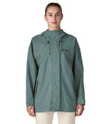 Woman wearing Patagonia outdoor everyday rain jacket in blue sage full zipped showing hood toggles. Coat has a relaxed fit